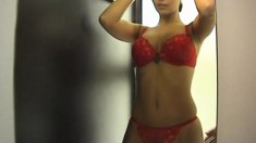 Wild and naughty girl gets naked and tries on lingerie in a shop