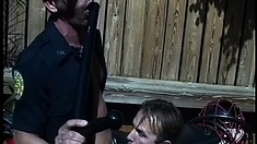 Naughty mechanic gives his hung customer's cock a fine tuning
