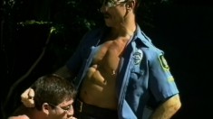 Two crooked cops order this submissive guy to blow them both off